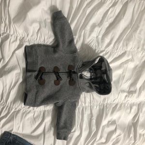 Grey coat with velcro wooden faux buttons.